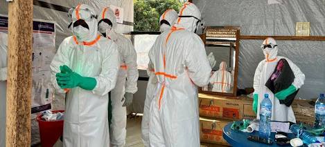 Healthcare workers in full PPE suit and protective gear during the 2026 Bundibugyo Ebola outbreak response in the Democratic Republic of Congo